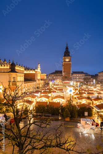 Obraz na płótnie View of the Krakow Christmas Market 2024 and the historic Old Town Square, beautifully illuminated with festive lights and vibrant holiday atmosphere. w salonie