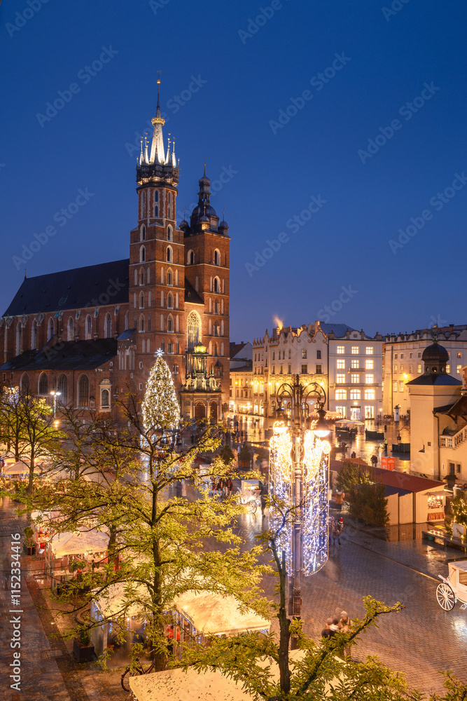 View of the Krakow Christmas Market 2024 and the historic Old Town Square, beautifully illuminated with festive lights and vibrant holiday atmosphere.
