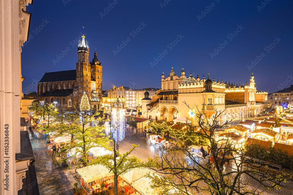 View of the Krakow Christmas Market 2024 and the historic Old Town Square, beautifully illuminated with festive lights and vibrant holiday atmosphere.