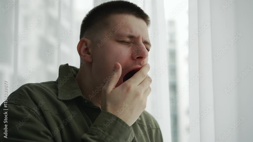 A man covers his mouth with his hand when he yawns.
The man yawns from fatigue.
Bad dream.
The man did not get enough sleep and yawns A man covers his mouth with his hand when he yawns.
The man yawns from fatigue.
Bad dream.
The man did not get enough sleep and yawns