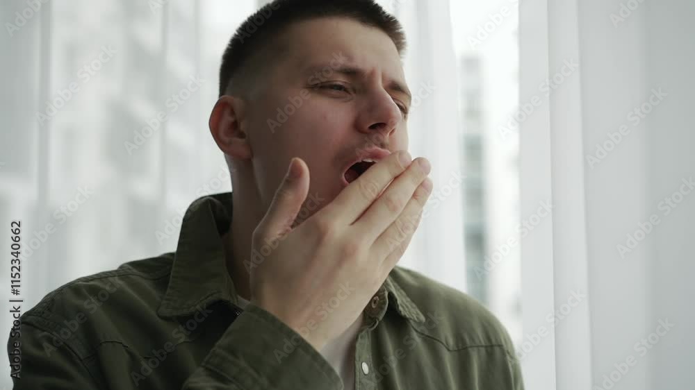 sleepy young man yawns from overwork.
The man in the green shirt yawns.
A person wants to sleep and cannot stop yawning.
Yawning, man, sleep, fatigue, overwork sleepy young man yawns from overwork.
The man in the green shirt yawns.
A person wants to sleep and cannot stop yawning.
Yawning, man, sleep, fatigue, overwork
