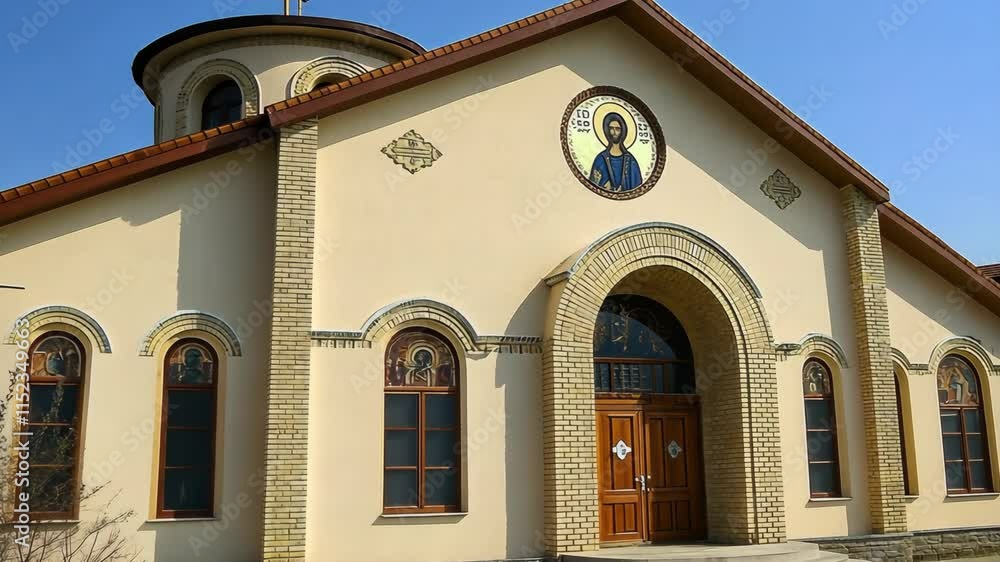 Beautiful church exterior featuring religious iconography and an ornate facade in clear blue skies Beautiful church exterior featuring religious iconography and an ornate facade in clear blue skies