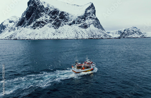 A Fishing Boat Navigating Through a Stunningly Snowy Arctic Landscape in Wintertime