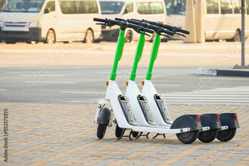 Pay-to-use electric scooter on the sidewalk in the city center