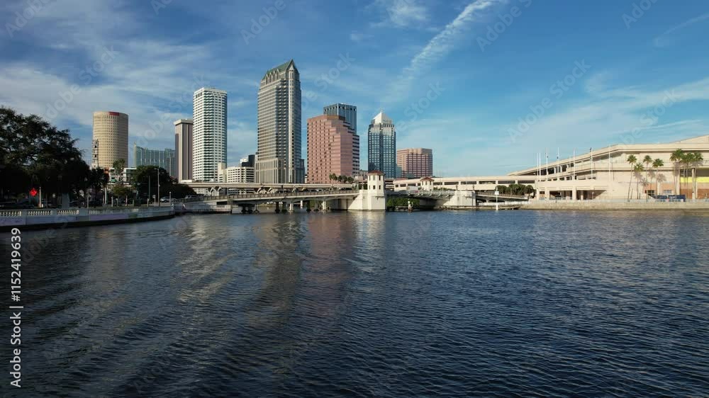 An aerial view of Tampa, Florida, showcases a vibrant skyline with modern high-rises, the iconic Hillsborough River winding through downtown, expansive waterfronts along Tampa Bay, and lush greenery An aerial view of Tampa, Florida, showcases a vibrant skyline with modern high-rises, the iconic Hillsborough River winding through downtown, expansive waterfronts along Tampa Bay, and lush greenery