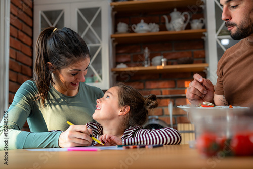 Quadro su tela As the family enjoys their breakfast, the daughter sits at the kitchen table con