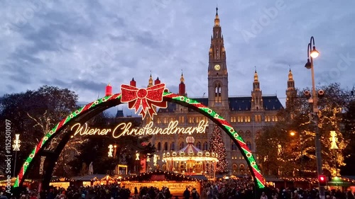 Famous traditional Christmas market (Christkindlmarkt) in front of the City hall during winter holidays, in Vienna, Austria. 4K
