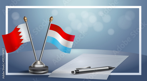 Bahrain and Luxembourg National flags on small table with bokeh background, cooperative relationship