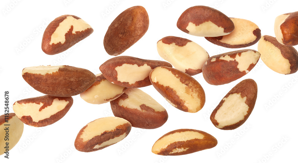 Many Brazil nuts in air on white background Many Brazil nuts in air on white background