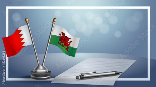 Bahrain and Wales National flags on small table with bokeh background, cooperative relationship