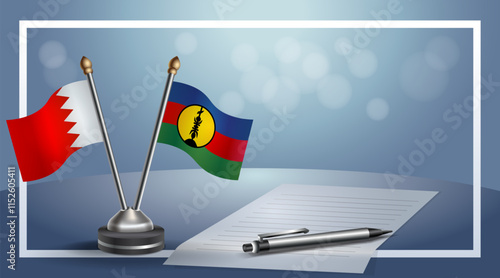 Bahrain and New Caledonia National flags on small table with bokeh background, cooperative relationship