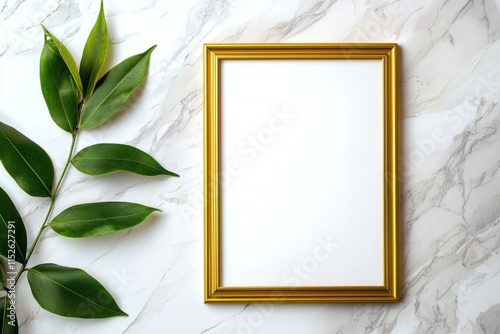 A gold framed picture with a leaf on the left side photo