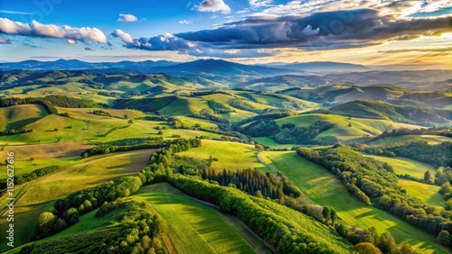 Aerial view of a scenic landscape with rolling hills and mountains in the distance, mountains, nature