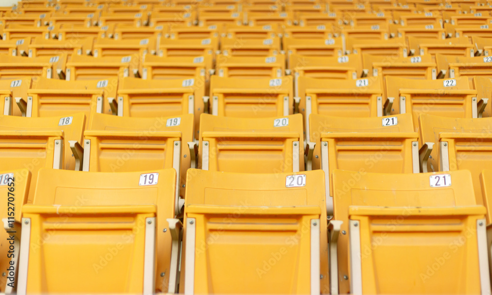 Fototapeta premium Empty stadium seats, anticipation, upcoming game, sports arena, no spectators, colorful seats, bleachers, grandstand, field view, before the match