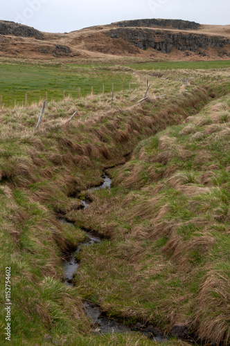 Drangsnes Iceland, irrigation ditch with flowing water  photo