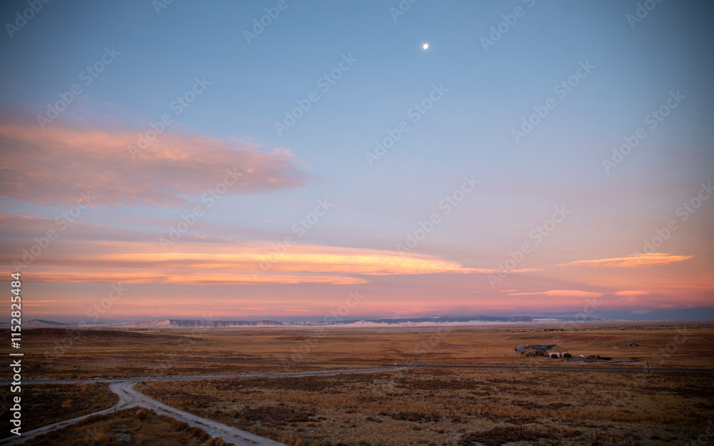 Coral sunset in mountain West Wyoming with moon Coral sunset in mountain West Wyoming with moon