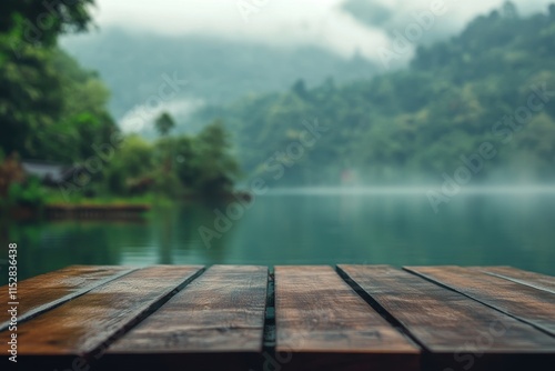 Misty lake view with empty wooden table. photo