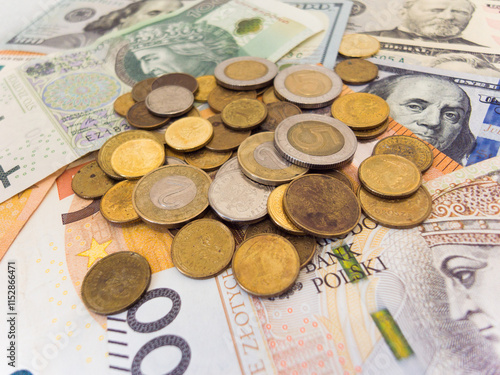 A pile of coins and bills including a 50 cent bill photo