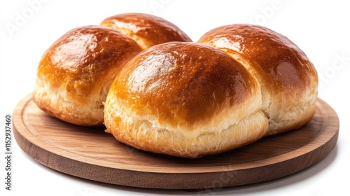 Savory meat-filled pastry buns on a wooden board with a golden-brown glaze showcasing delicious baked goods for culinary uses photo