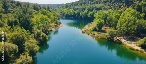 Scenic river landscape showcasing lush riverside woodland in a protected natural park within the Natura 2000 ecological network.