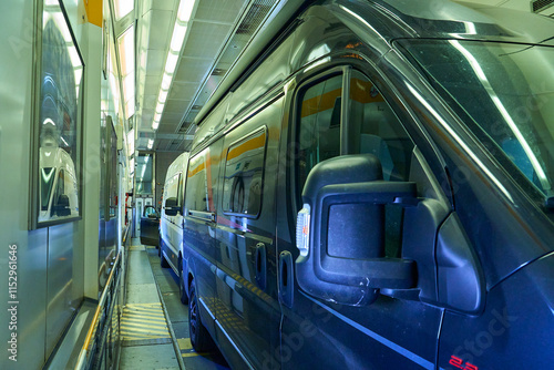 mobile home parked in a train wagon of railway between Calais and Folkestone taking the channel tunnel between France and England, connection between Europe mainland and united kingdom.