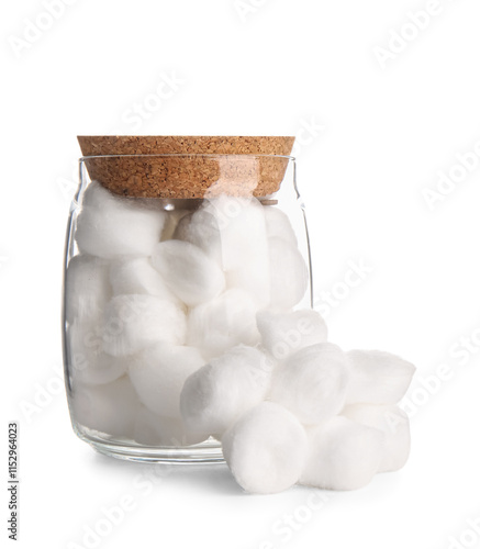 Jar with cotton balls on white background photo