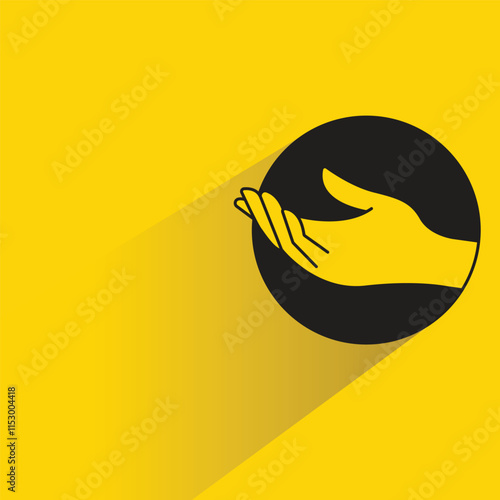 begging hand gesture with shadow on yellow background