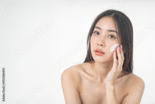 Realistic Generative AI of Asian woman applying skincare on white background, Free space for text.