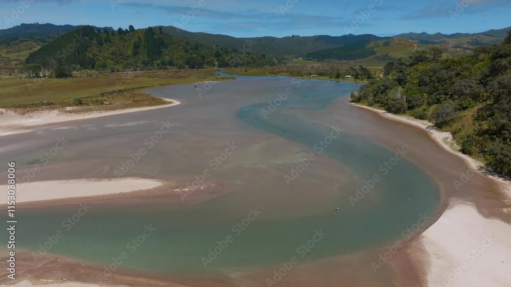 Aerial view of a tranquil estuary, winding through a pristine white sand beach. Coastal New Zealand landscape. WAIKAWAU BAY, COROMANDEL PENINSULA, NEW ZEALAND Aerial view of a tranquil estuary, winding through a pristine white sand beach. Coastal New Zealand landscape. WAIKAWAU BAY, COROMANDEL PENINSULA, NEW ZEALAND