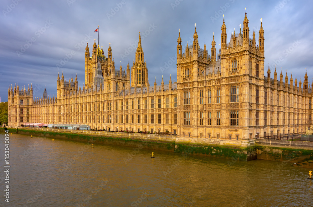 Houses of Parliament along Thames river, London, UK Houses of Parliament along Thames river, London, UK