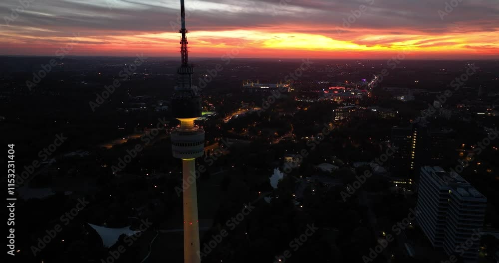 Aerial drone of the city skyline with the TV tower of Dortmund, Germany at sunset