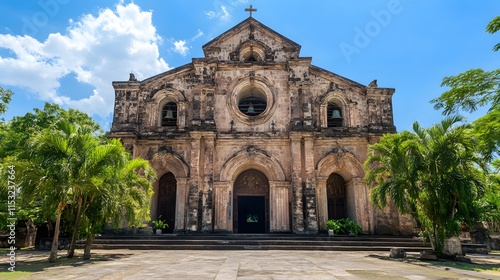 Front view of the historic Paoay Church in Ilocos Norte, with its grand facade glowing under a bright blue sky, in 4K resolution