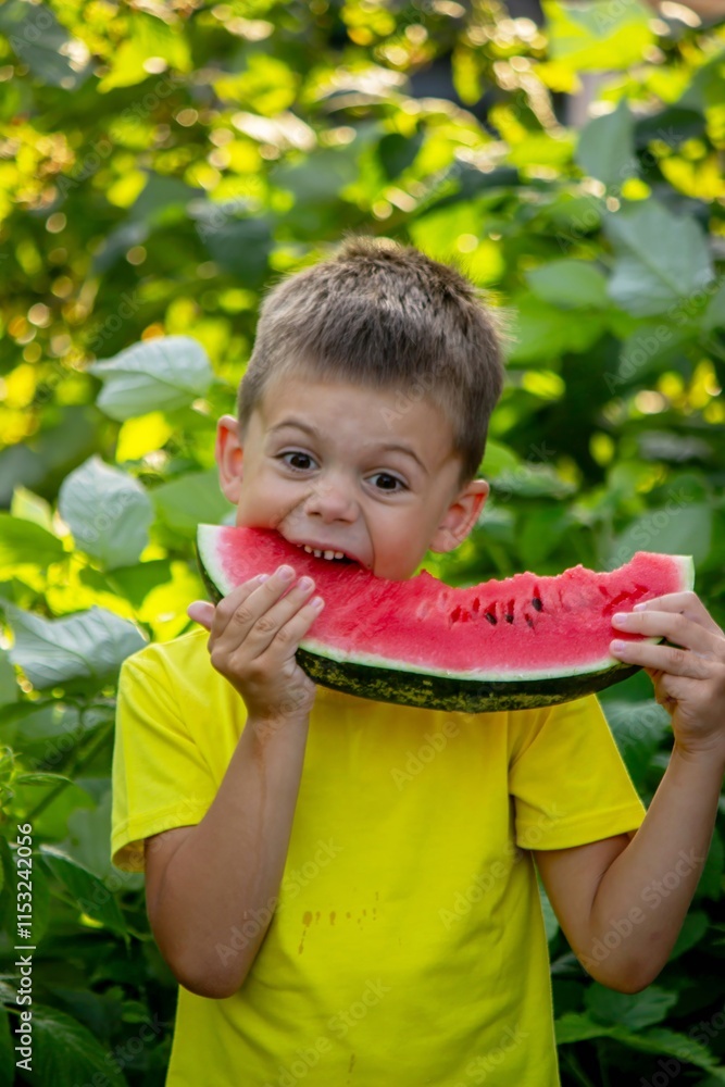 The child eats watermelon in the summer. Selective focus The child eats watermelon in the summer. Selective focus