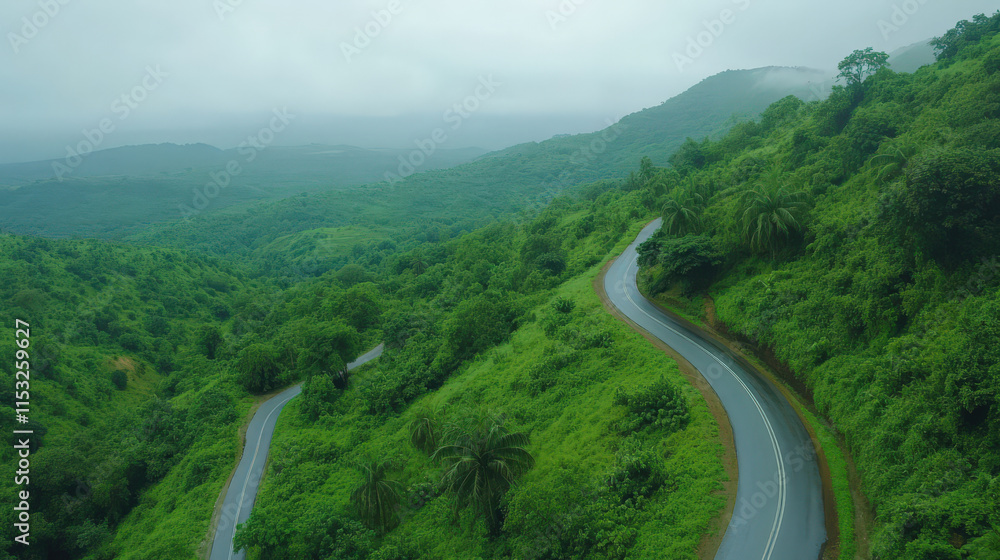Serene winding road through lush green hills on rainy day Serene winding road through lush green hills on rainy day