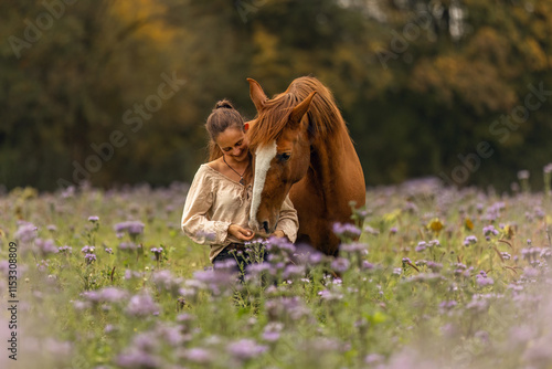 Cuadro en lienzo A woman and her Lusitano horse cuddling and interacting on a wildflower meadow i