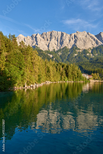 Scenic View of Eibsee Lake with Zugspitze Mountain at Sunset in Bavaria, Germany. Stunning Eibsee Lake with Zugspitze Reflection at Sunset in Bavaria, Germany. Tranquil Alpine Scene Captures the