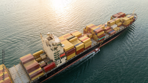 Cargo Container ship at sunset. ship carrying container and running for import export concept technology freight shipping by ship. photo