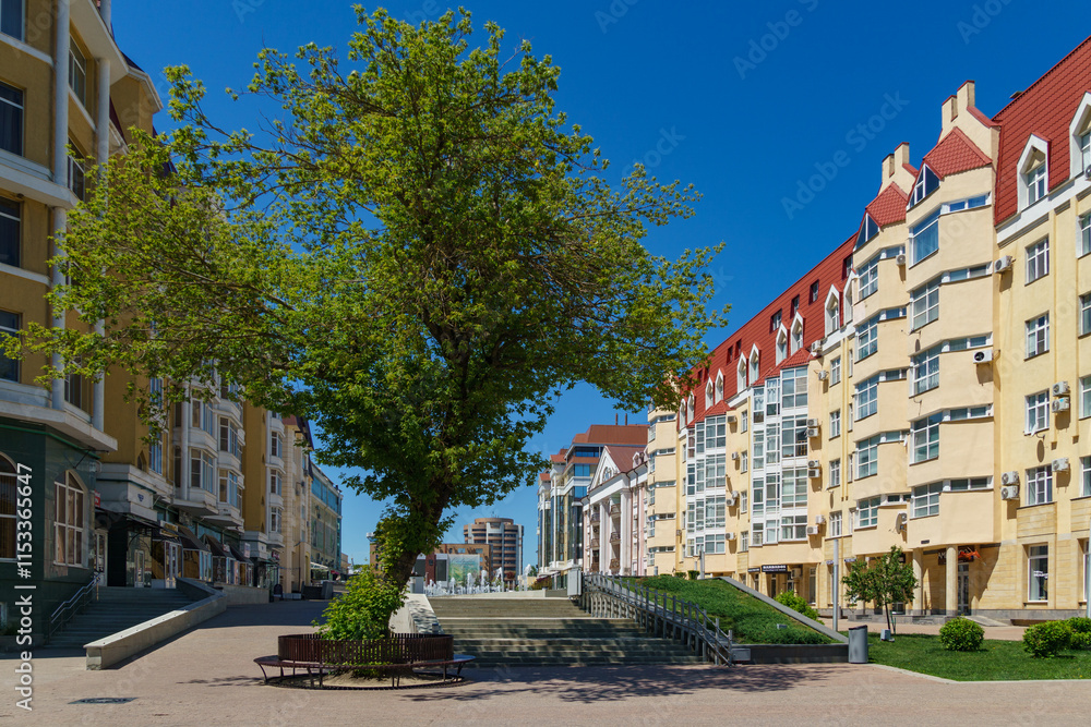 Fototapeta premium Cascade of fountains in center of Stavropol. The pedestrian street is favorite place for citizens and tourists of administrative center of Stavropol Krai. Stavropol, Russia - May 23, 2024