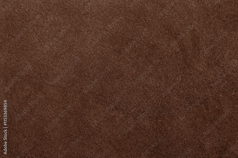 Fototapeta premium Close-up of soft velour fabric texture in Pantone 2025 color Mocha Mousse.