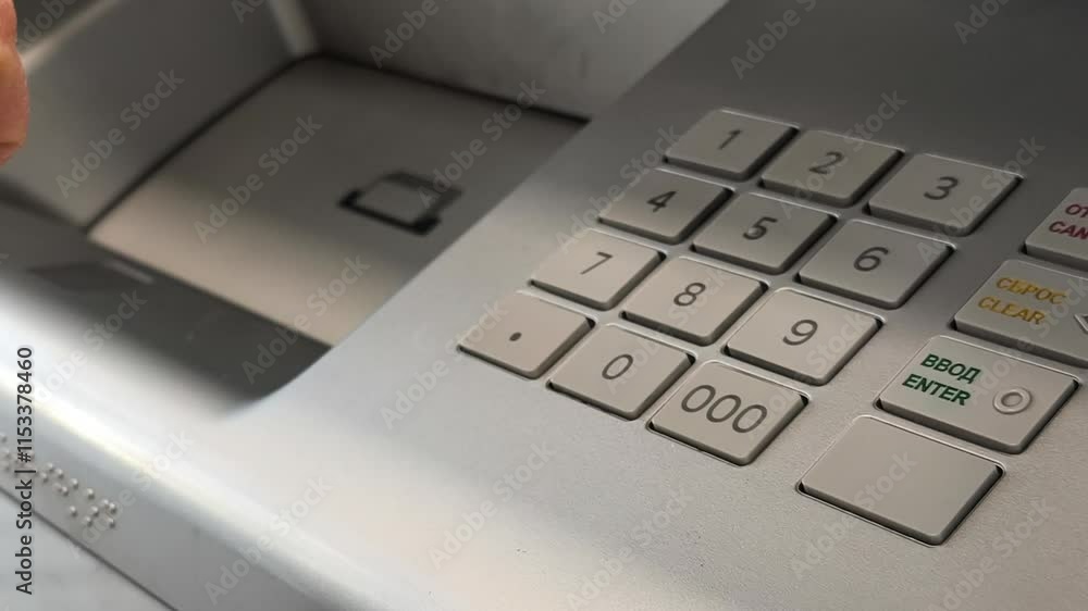 Entering ATM cash machine PIN code, close-up Entering ATM cash machine PIN code, close-up