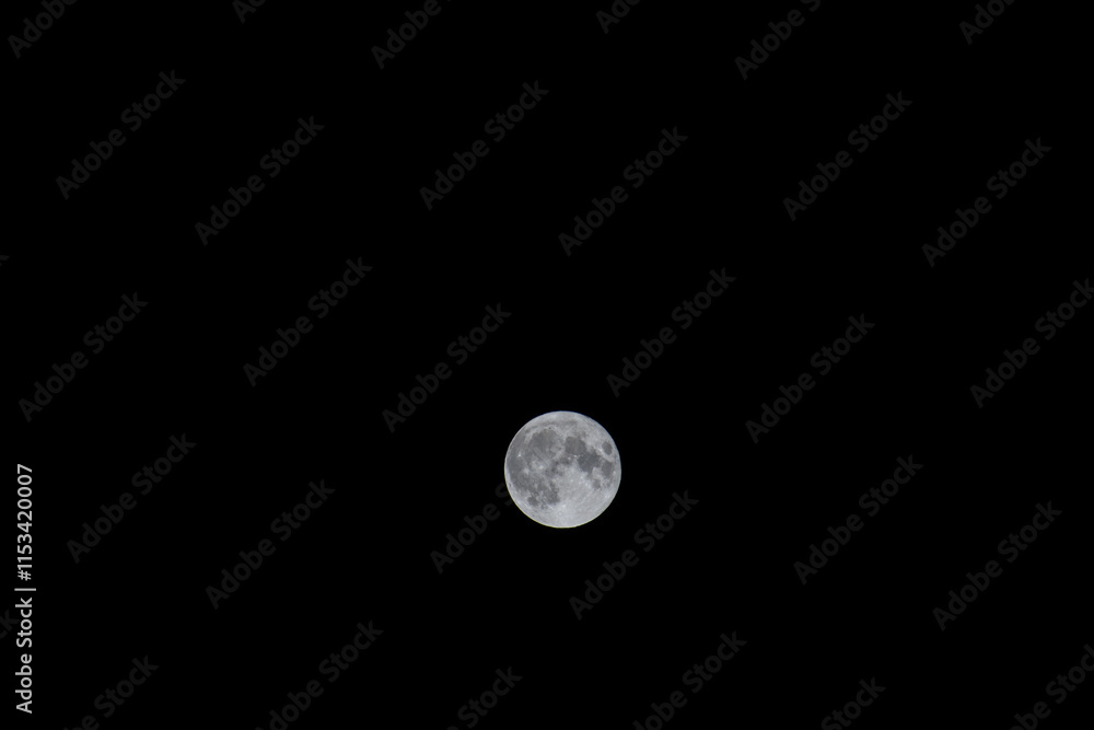 Full moon shining brightly in the night sky. Full moon shining brightly in the night sky.