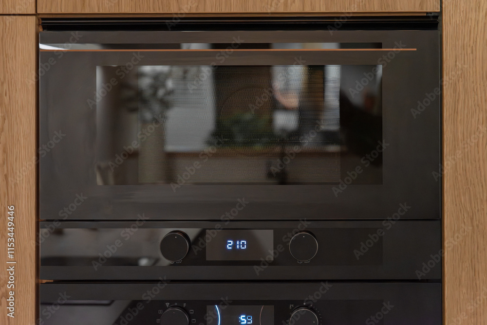 Built in microwave oven in the kitchen furniture, front view Built in microwave oven in the kitchen furniture, front view