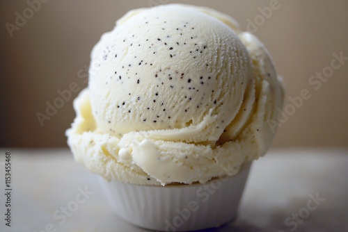 smooth scoop of vanilla ice cream with visible specks of vanilla bean under soft natural light photo