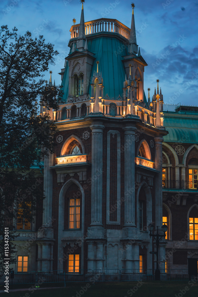 Illuminated Gothic tower with arched windows at dusk Illuminated Gothic tower with arched windows at dusk