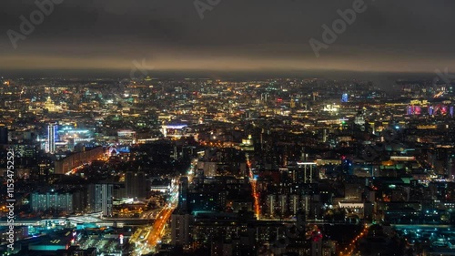 Wallpaper Mural Moscow, Russia - November 9, 2024: City skyline illuminated at night with skyscrapers and vibrant lights showcasing urban life Torontodigital.ca