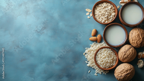 Vegan non dairy alternative milk. Coconut, almond, hazelnut, oat homemade milk on stone table. Top view with copy space. photo