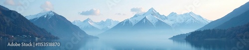 Wallpaper Mural Shrouded in mist, snow-capped mountains rise majestically from lake surface, peaks, serene, misty Torontodigital.ca