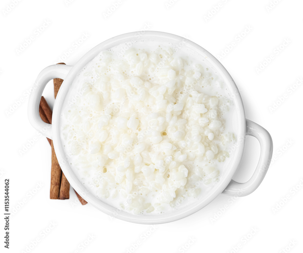 Delicious rice pudding with cinnamon sticks isolated on white Delicious rice pudding with cinnamon sticks isolated on white
