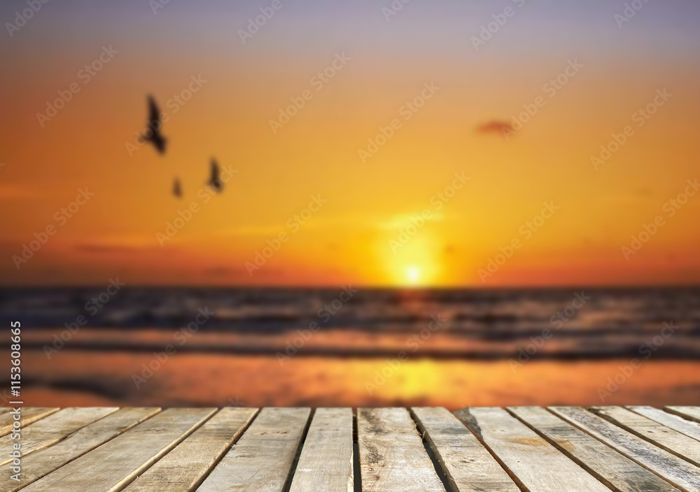 Wooden table top on the beach or sea.Party on the beach sunset time concept.For montage product display or design key visual layout.View of copy space. Wooden table top on the beach or sea.Party on the beach sunset time concept.For montage product display or design key visual layout.View of copy space.
