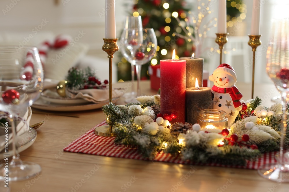 Christmas place setting with festive decor on wooden table in room Christmas place setting with festive decor on wooden table in room